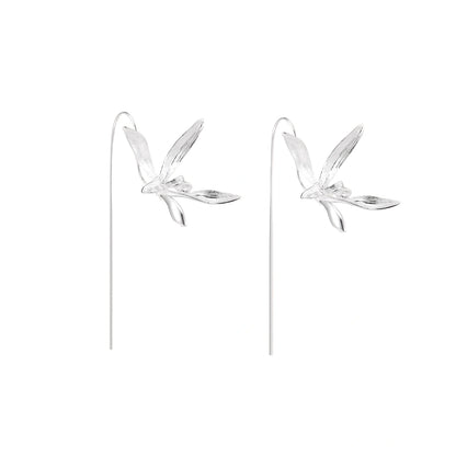 Delicate sterling silver dragonfly earrings with textured wings and curved threader hooks on white background